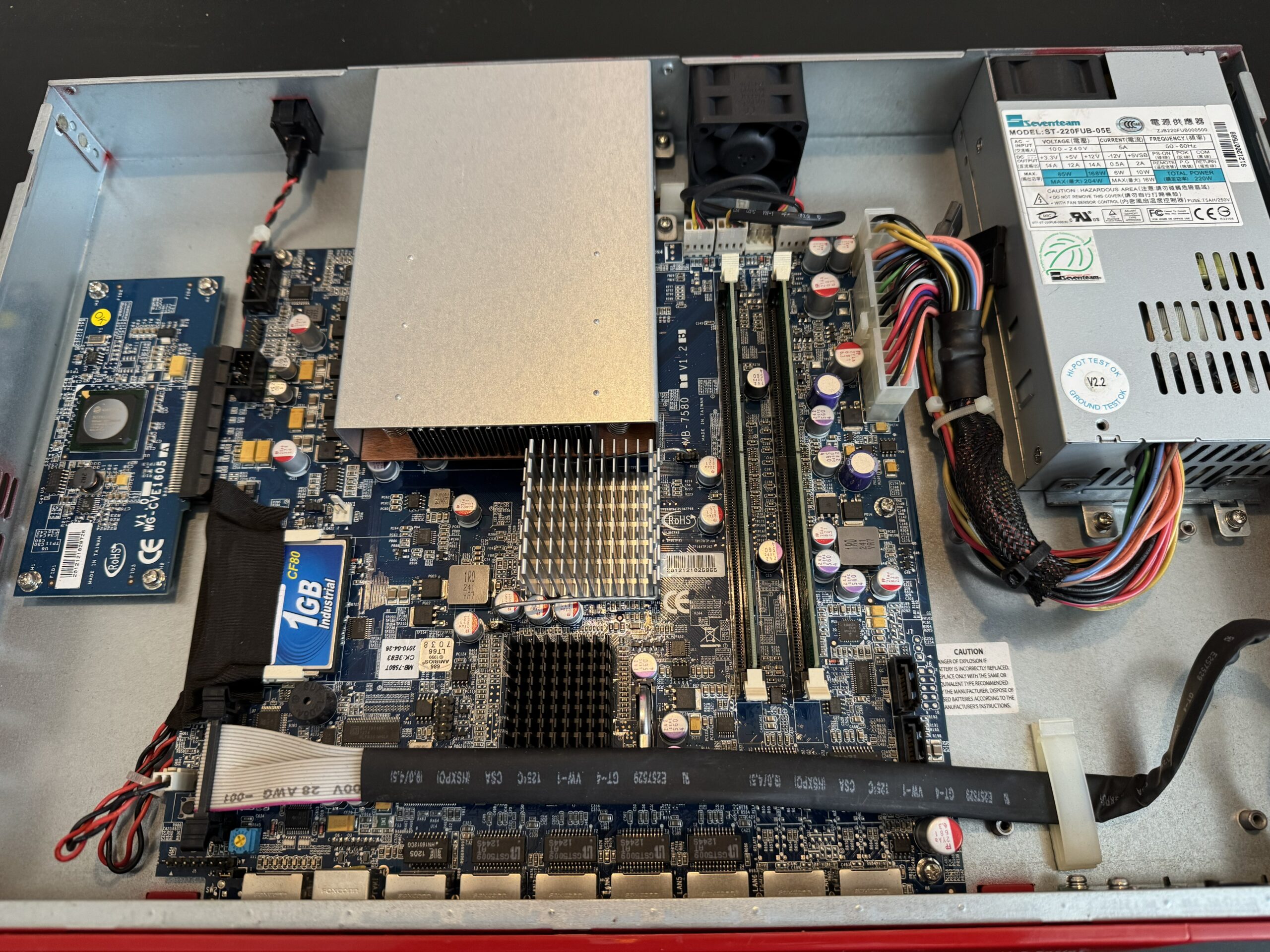 Inside the repurposed WatchGuard XTM showing motherboard and internal components